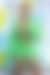 تحظى الألوان الخضراء الزاهية بشعبية كبيرة على سجادة VMA ، حيث يرتدي مغني الراب Latto فستانًا قصيرًا بأربطة في ظل نيون.